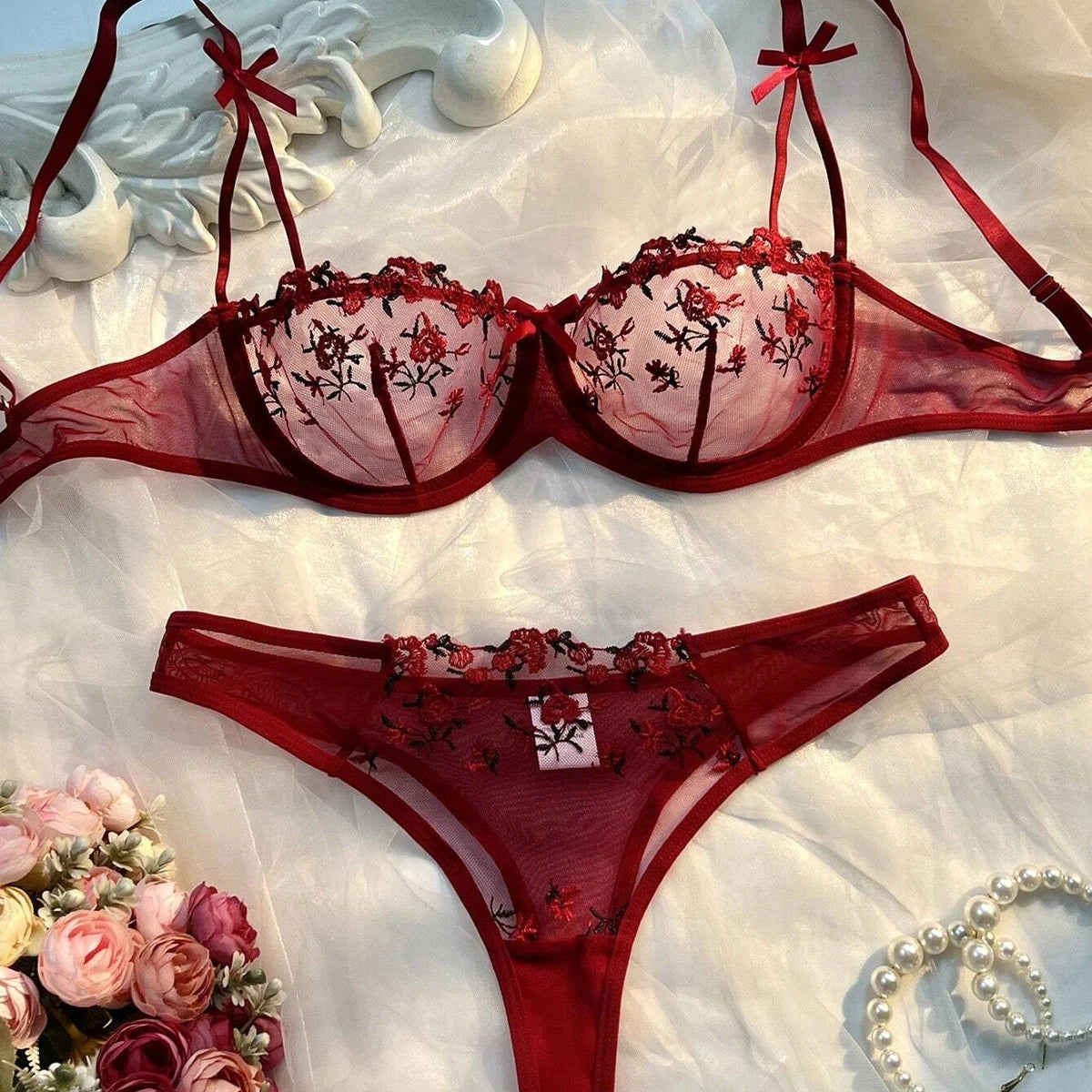 Burgundy sheer lace bra and matching thong with floral embroidery and ribbon ties