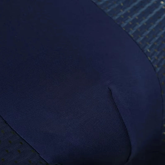 Navy boxer briefs close-up of leg fabric with stitched seam and dotted side panel