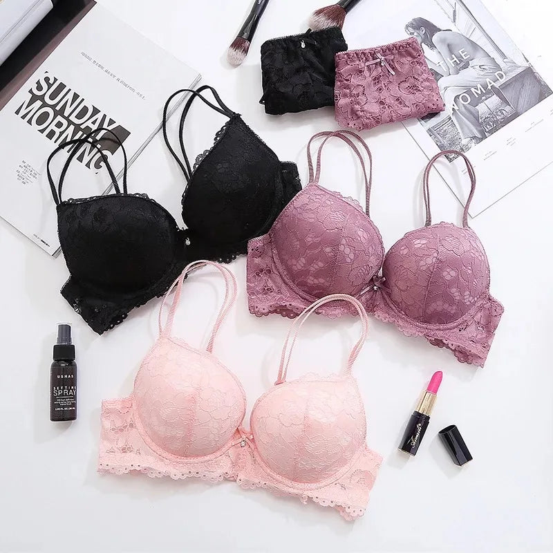 Black, blush, and burgundy lace underwired push-up bra set with matching briefs