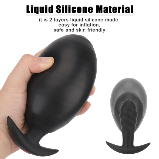 Inflatable anal plug, matte black, hand-held with curved tip and flared base prongs