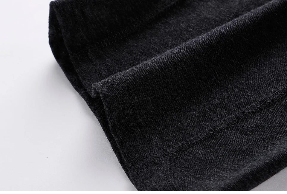 Cotton long boxer brief fabric, dark charcoal knit with visible seam and texture.