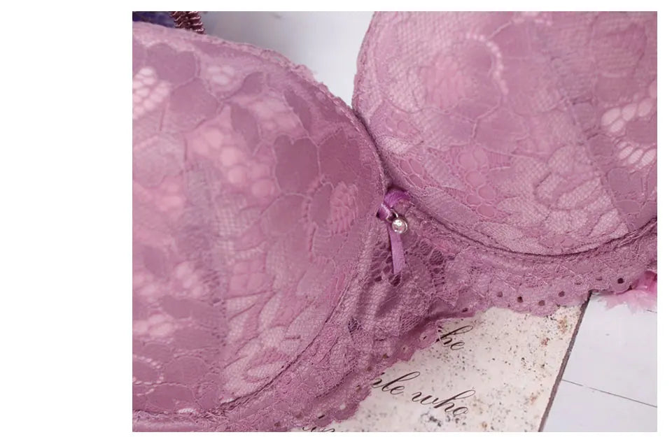 Close-up of pink lace bra cups and center clasp