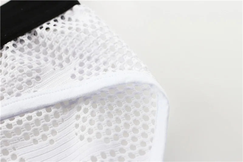 White breathable brief with perforated mesh texture and stitched side seam