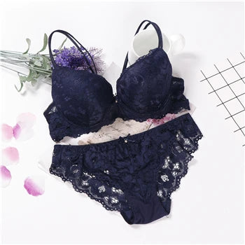 Navy/dark blue underwired push-up lace bra set with matching lace panties, laid flat