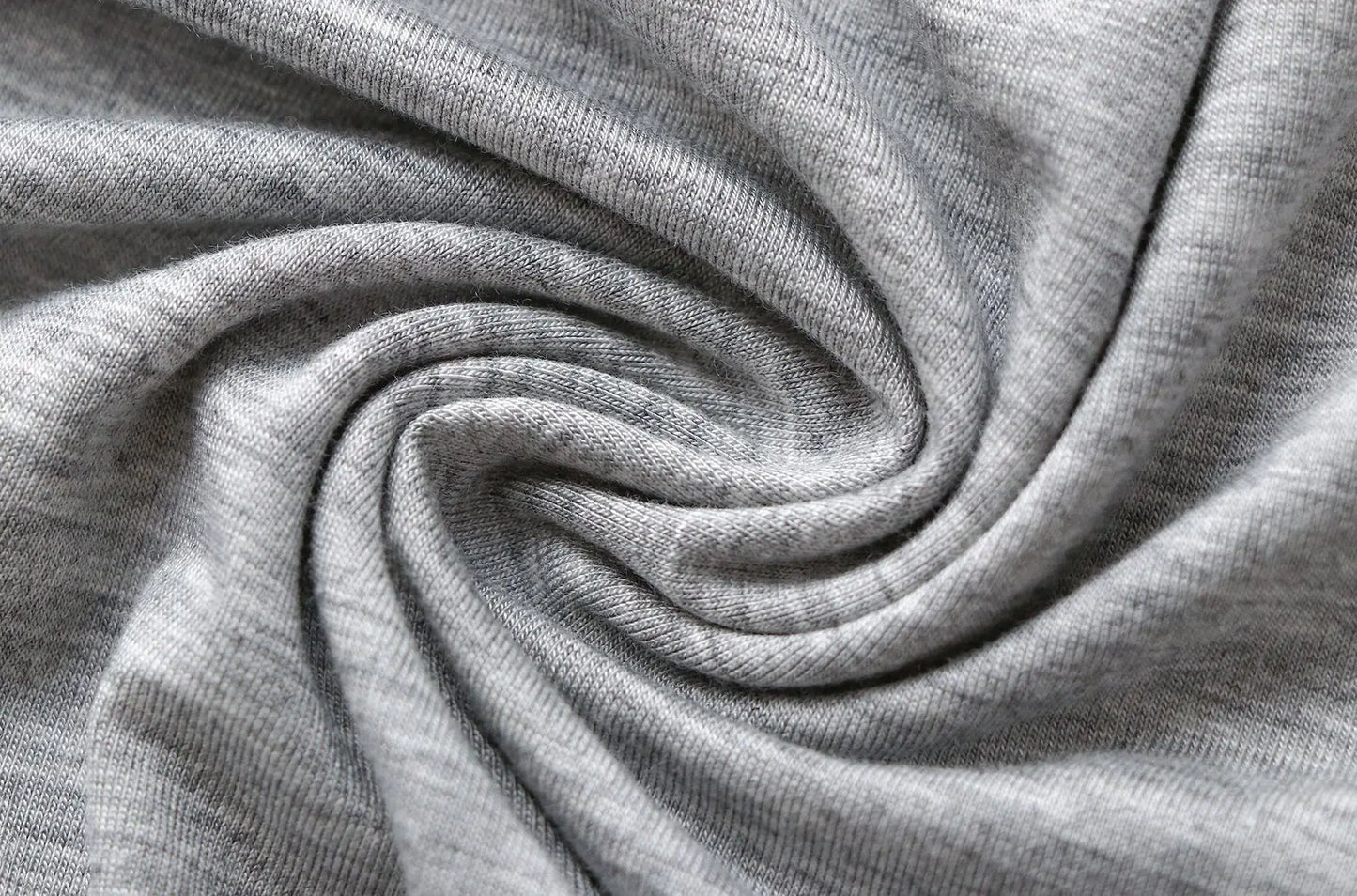 Gray jersey fabric close-up with soft folds