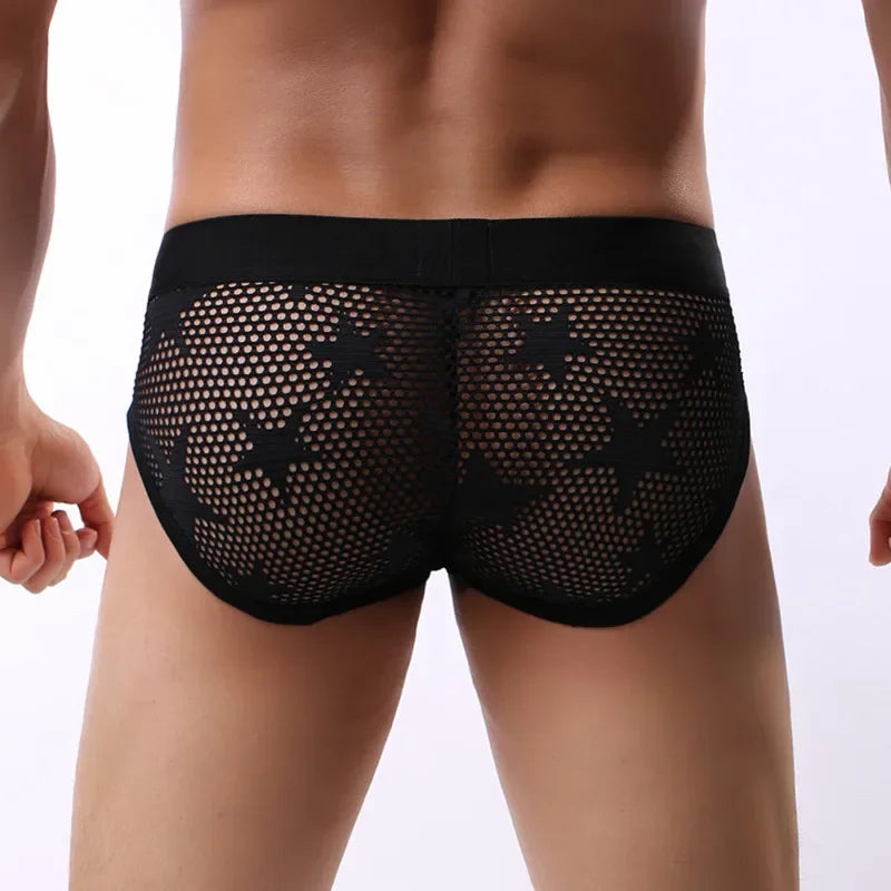 Black breathable brief on model, perforated mesh with logo waistband, front view