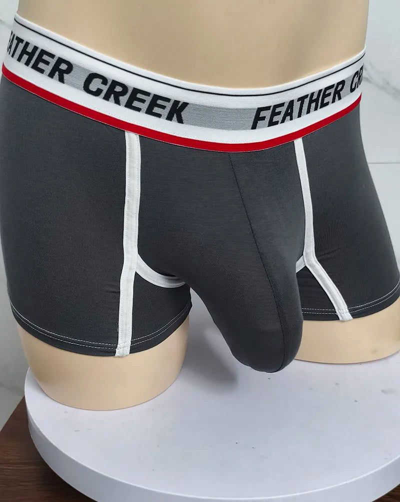 Dark gray sports boxer shorts with white contrast seams and contoured front pouch