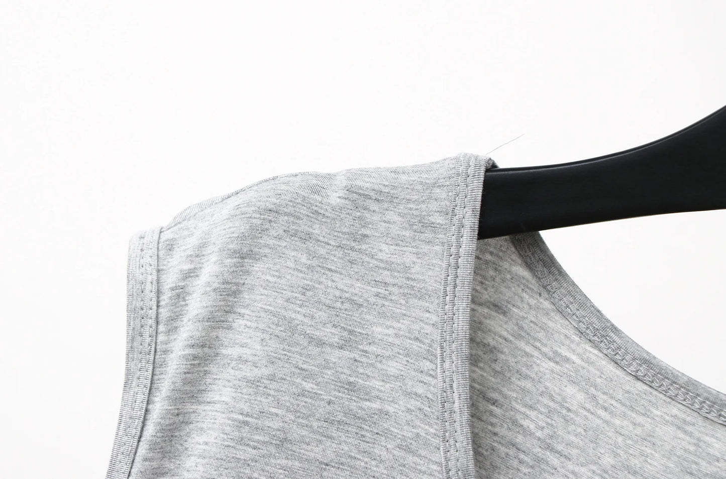 Gray sleeveless sleepwear vest dress armhole and shoulder seam close-up