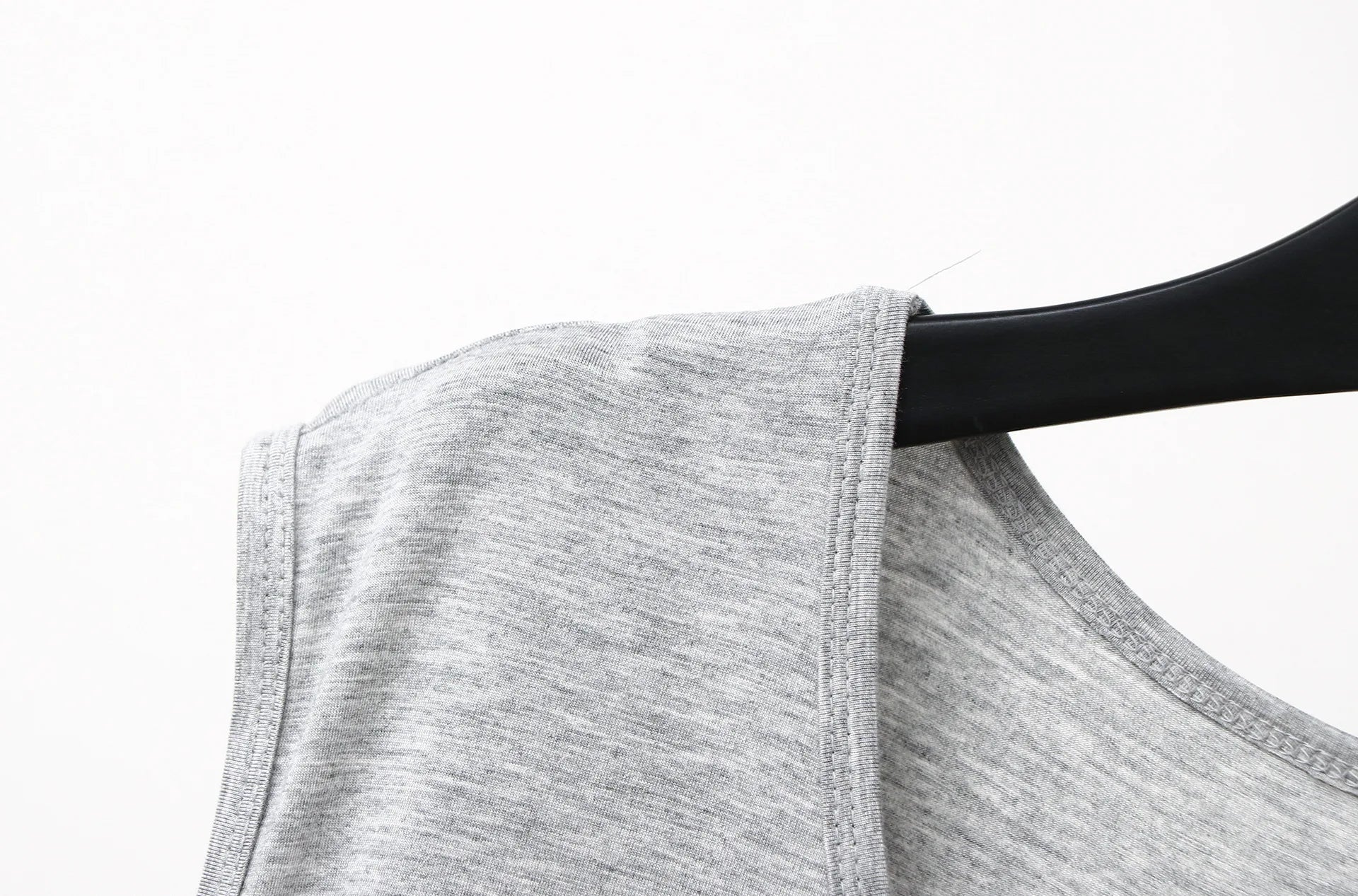 Gray sleeveless sleepwear vest dress armhole and shoulder seam close-up