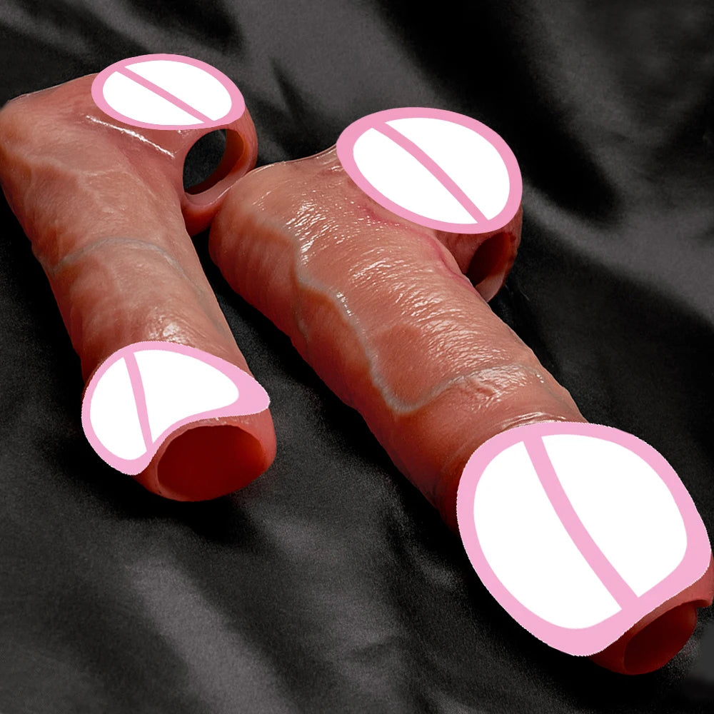 Silicone penis extension sleeve, brown, close-up pair showing rounded ends and inner openings