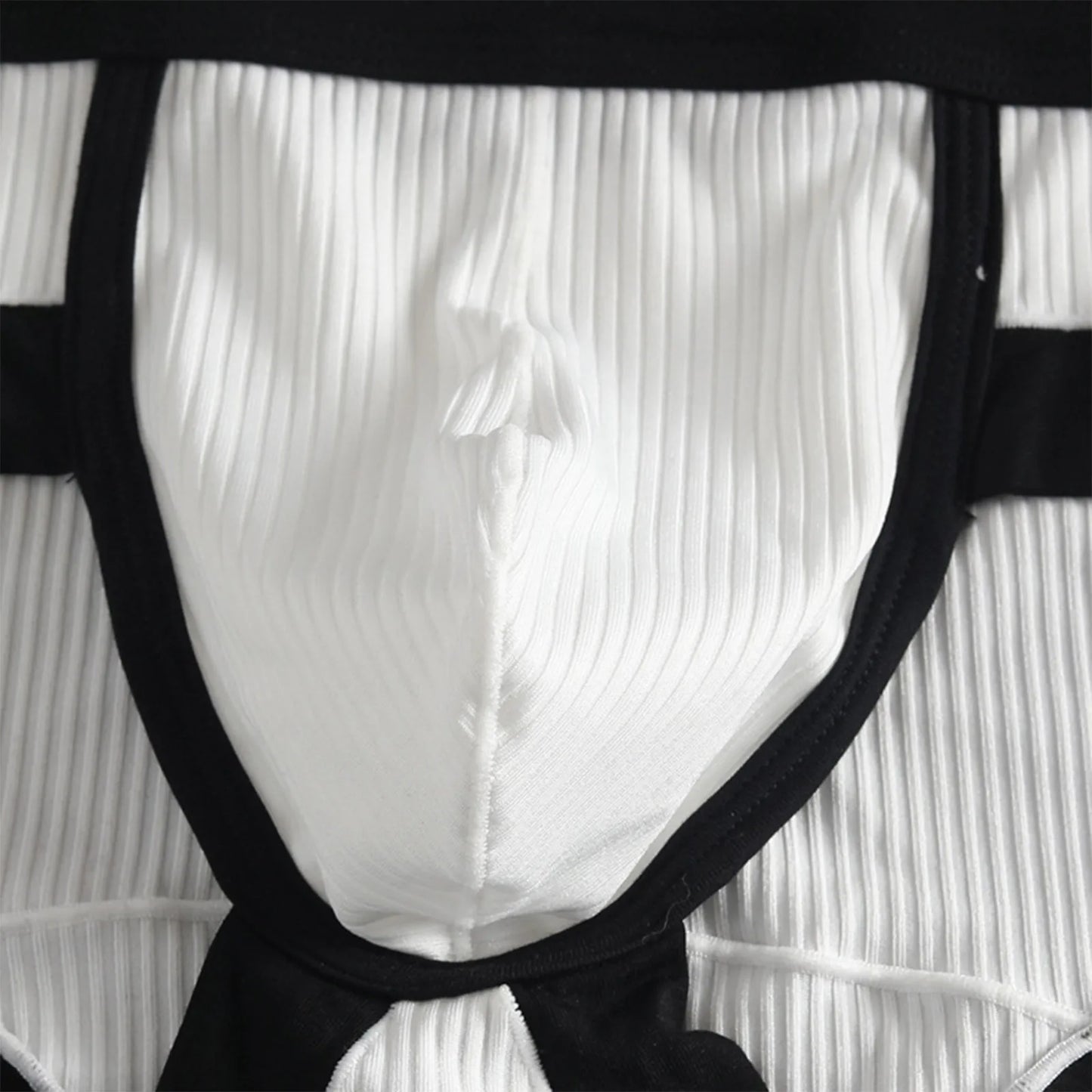 U-pouch view of striped brief in white ribbed fabric with black edging