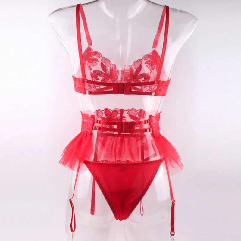Red embroidered mesh lingerie set on mannequin: underwire bra, ruffle garter skirt, briefs.