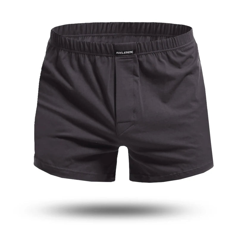 Black cotton pyjama boxer shorts, front view with elastic waist and center seam