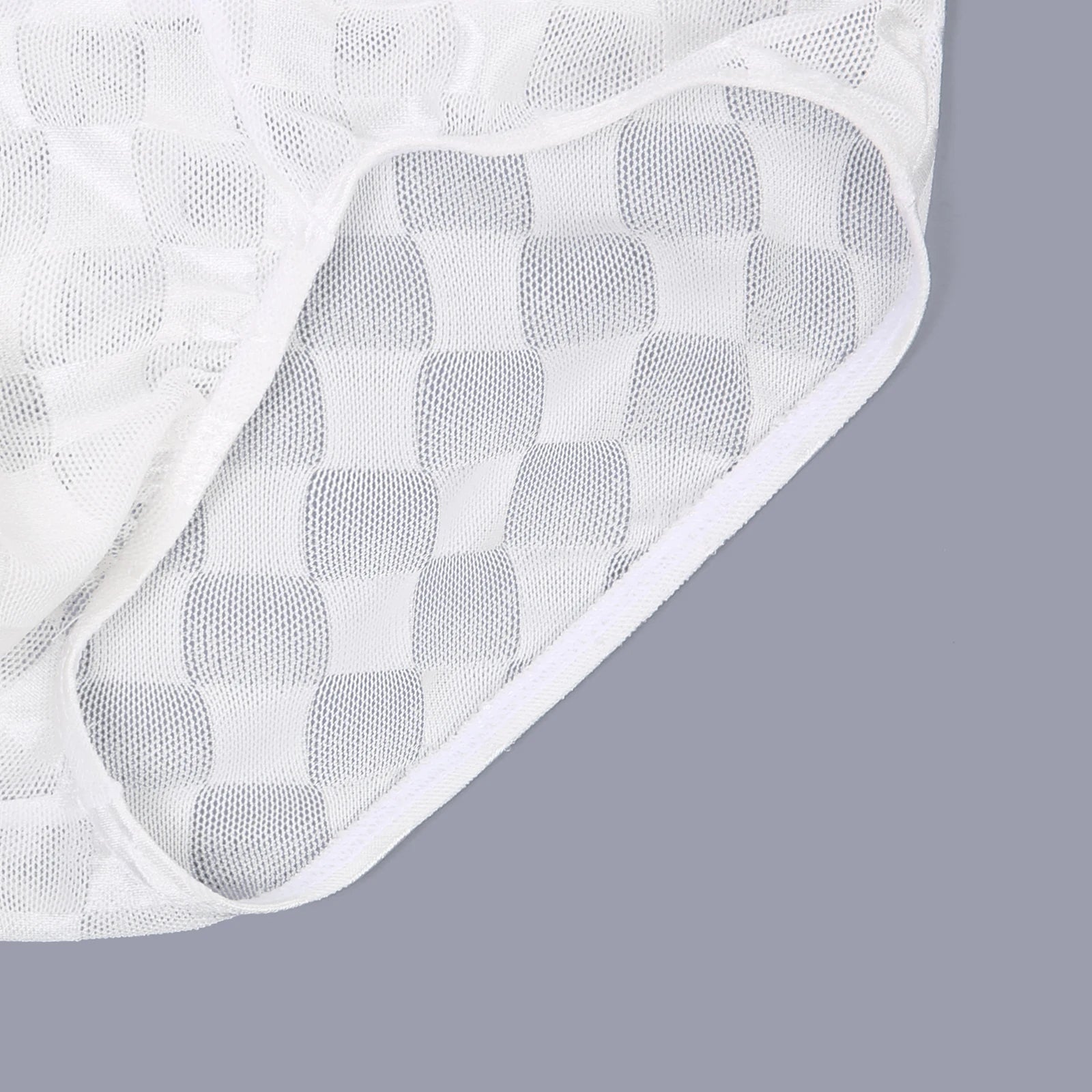 White checkered transparent mesh brief with breathable net texture at the leg opening