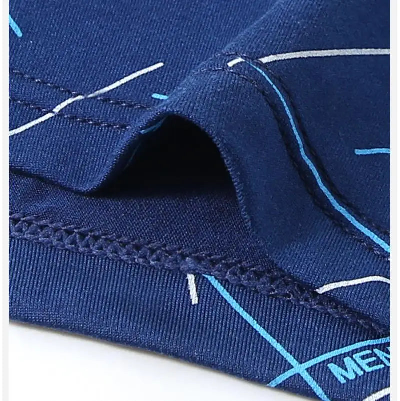 Close-up of blue stretch trunks with white line pattern and elastic waistband