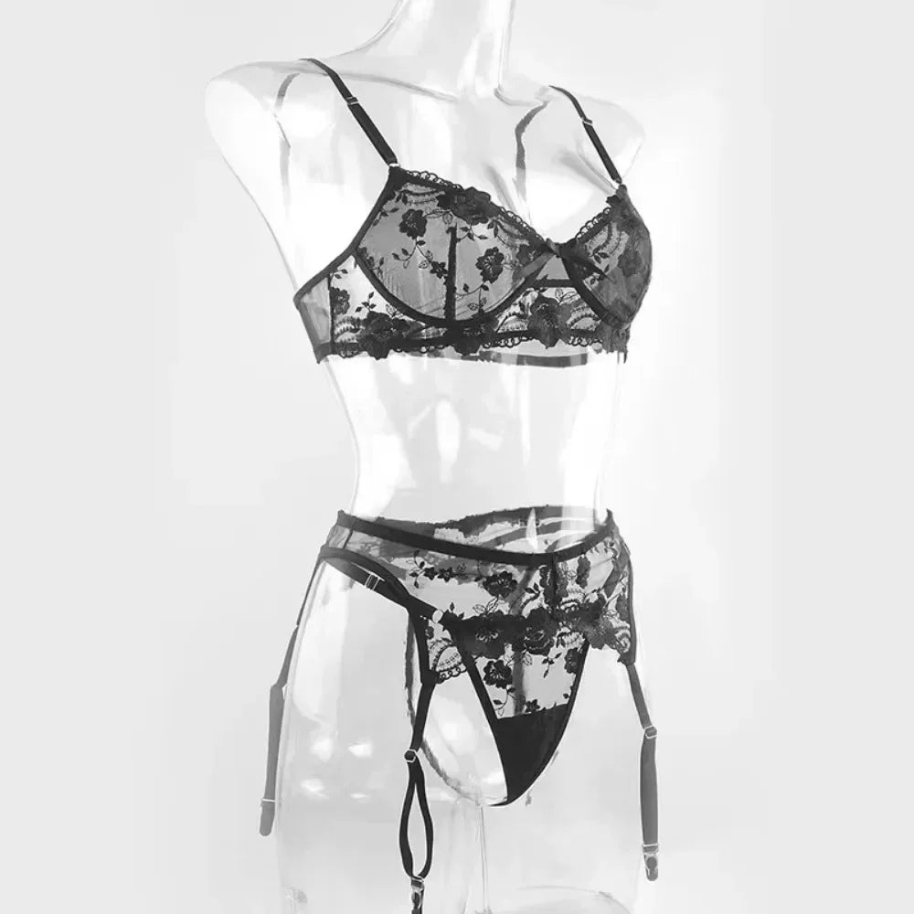 Black sheer lace push-up bra and garter panty with suspender straps