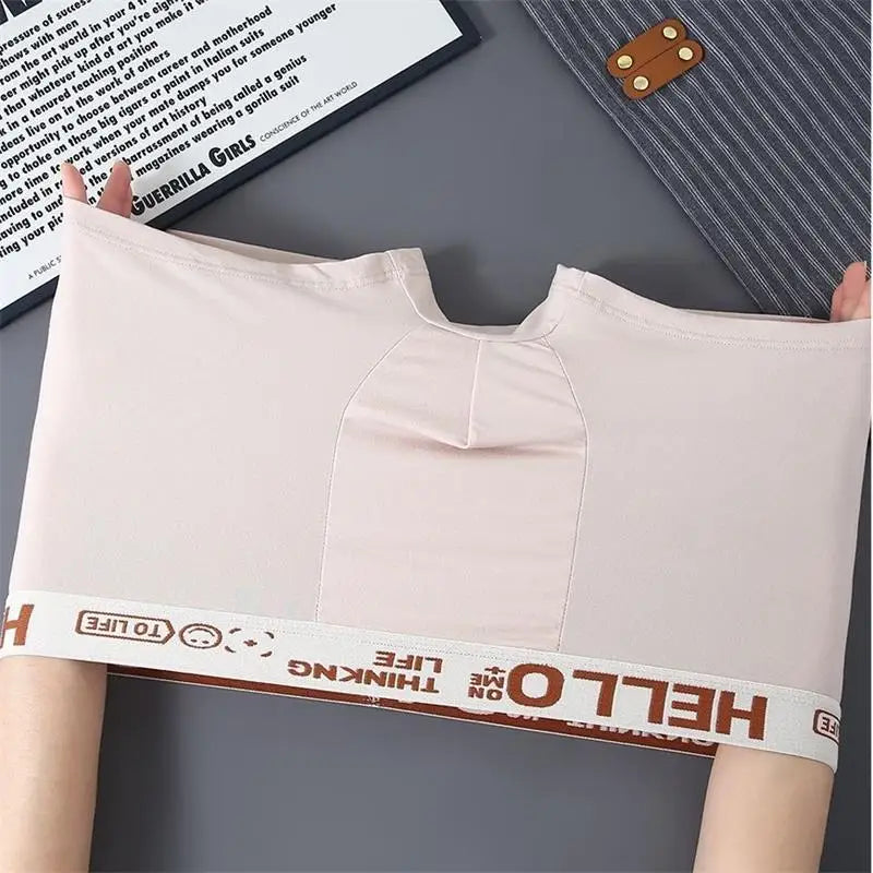 Cream seamless boxer briefs with contoured pouch panel and “HELLO” waistband