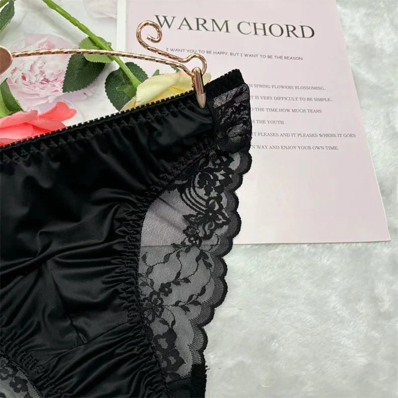 Black lace U-pouch brief, scalloped leg trim and sheer floral jacquard side panel close-up