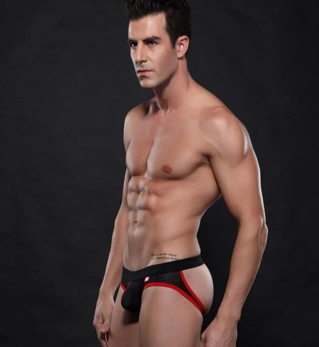 Low-rise hip-lift thong on model side view, white with black waistband trim
