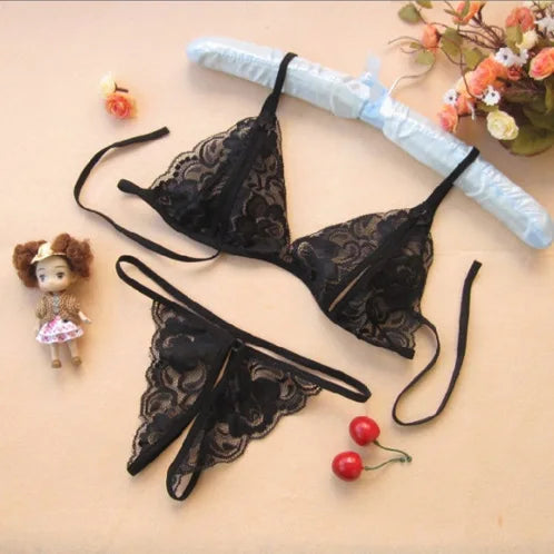 Black lace bodysuit set with crisscross front straps and garter thigh bands