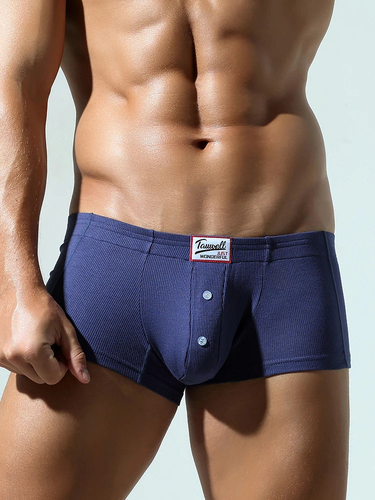Dark blue slim-fit brief with front button placket and wide waistband logo patch
