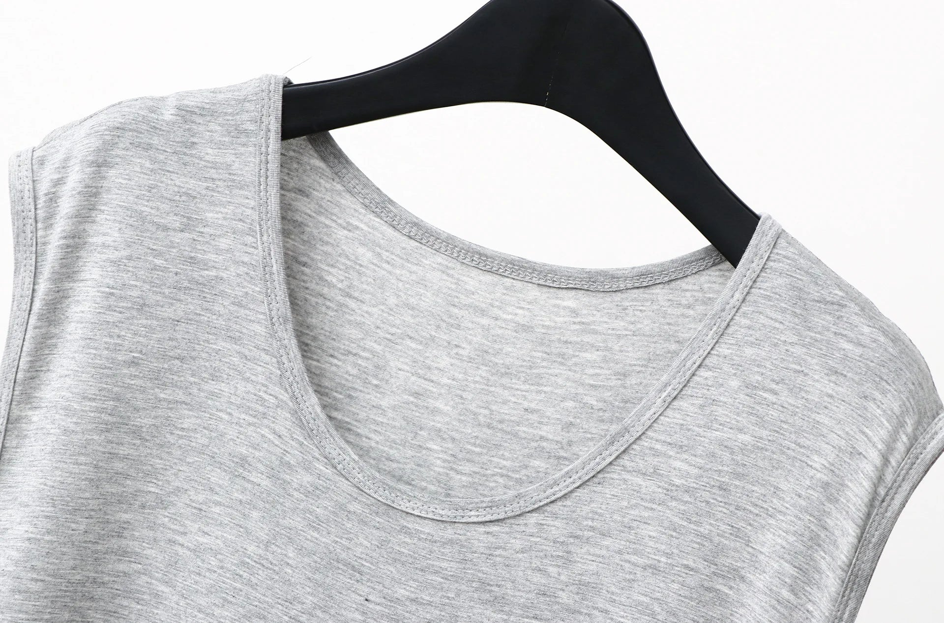 Gray sleeveless sleepwear vest dress neckline and shoulder seam close-up