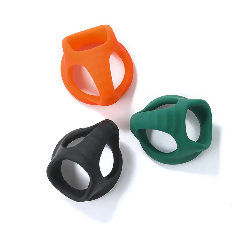 Orange, green, black silicone delay cock rings with oval openings, three-piece view
