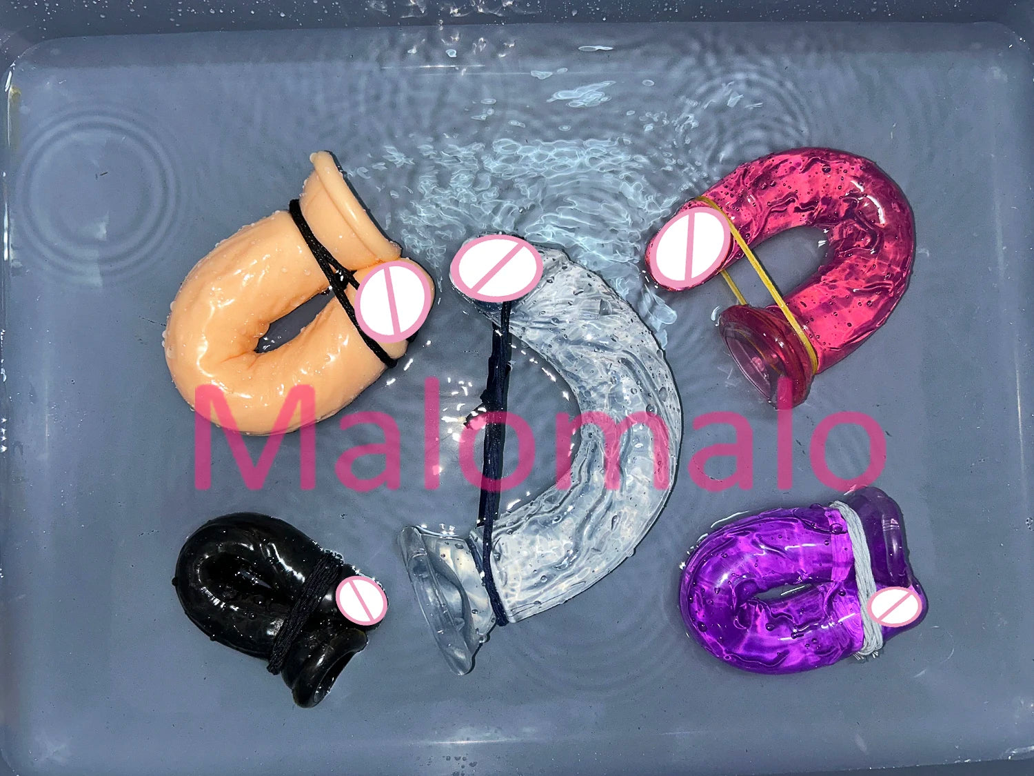 Transparent jelly sex toy set with suction bases in flesh, black, magenta, and clear blue