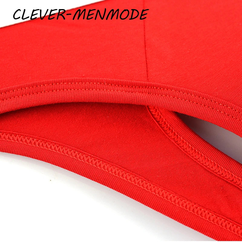 Red open-back cotton anal brief waistband and stitched leg opening, close-up
