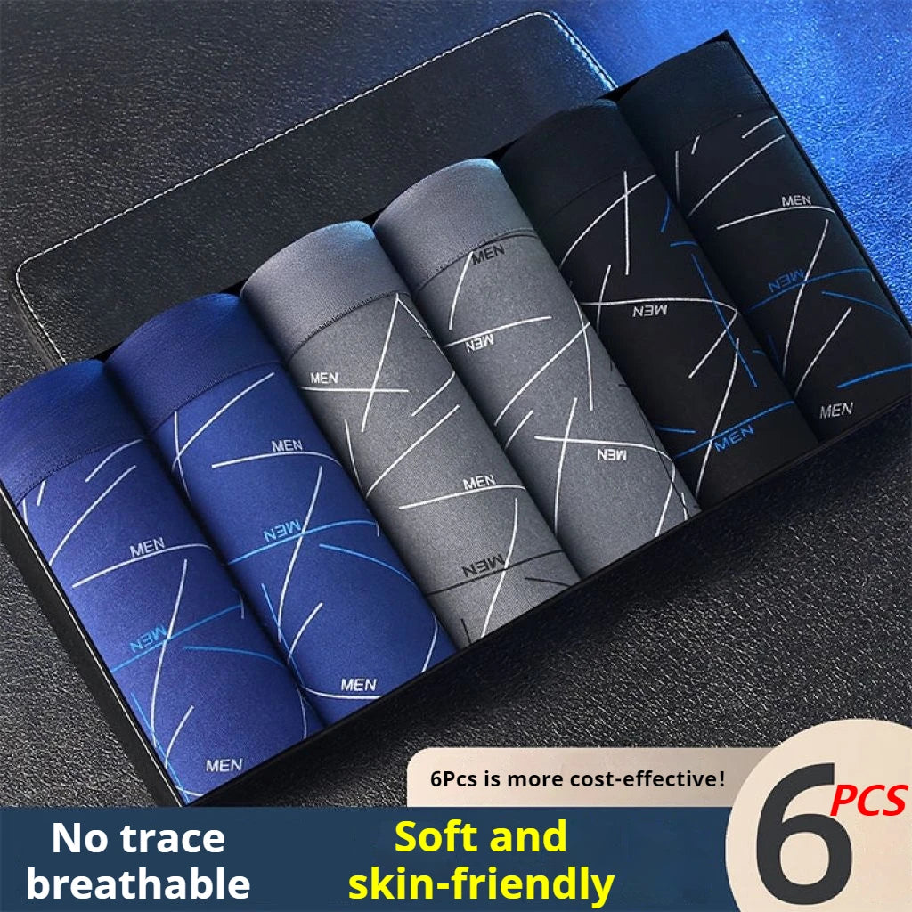 6-pack men’s stretch trunk shorts, mixed blues and grays folded in a tray