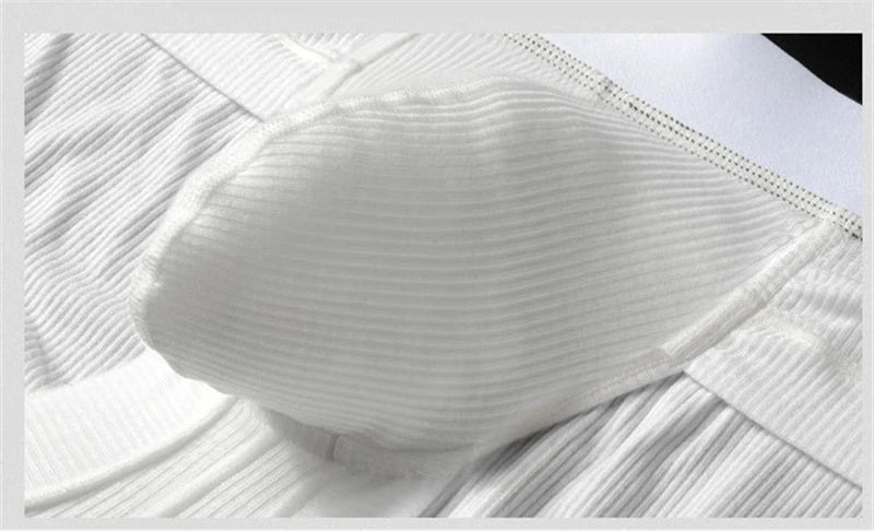 White U-pouch boxer briefs close-up of contoured pouch and textured knit.
