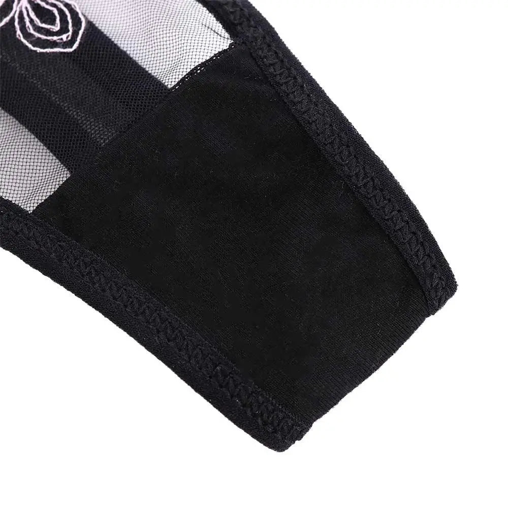 Black embroidered lace panty brief close-up of fabric and scalloped edge
