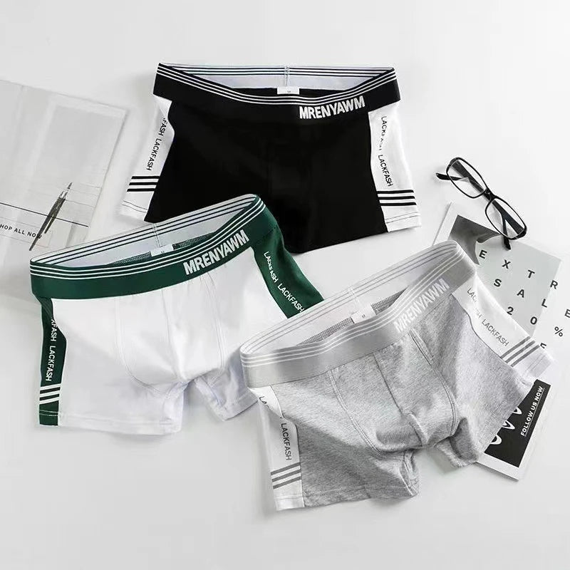 Mid-rise boxer shorts in black, green, white, and gray with striped waistbands