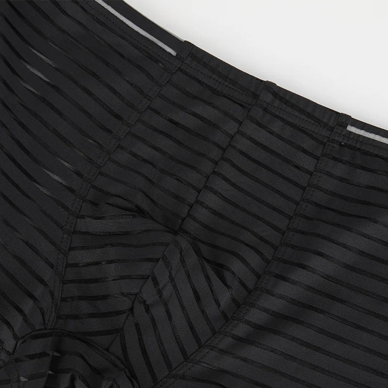 Black mesh boxer brief fabric close-up with thin horizontal stripes