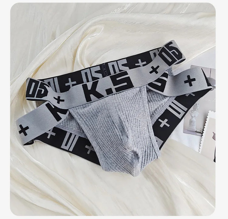 Gray ribbed stretch brief with wide elastic waistband and black logo print.