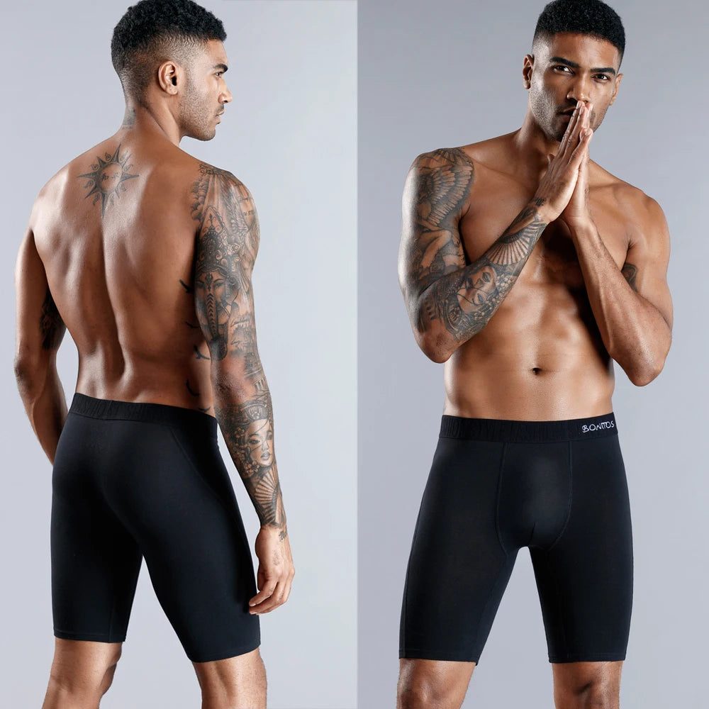 Men's long boxer briefs in black with elastic waistband and fly front.