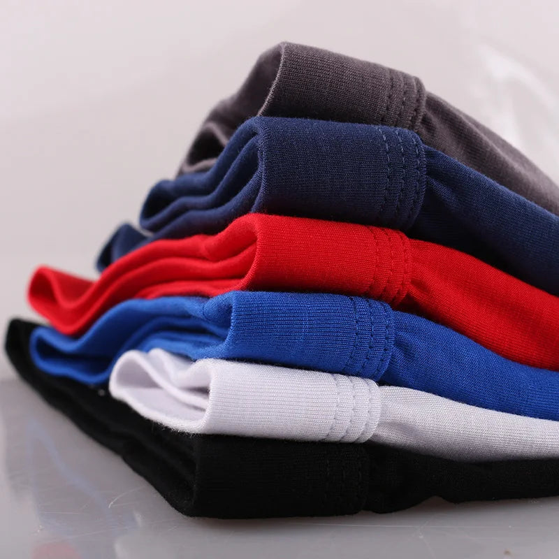 Folded boxer briefs stack in dark, blue, red, white, and gray tones