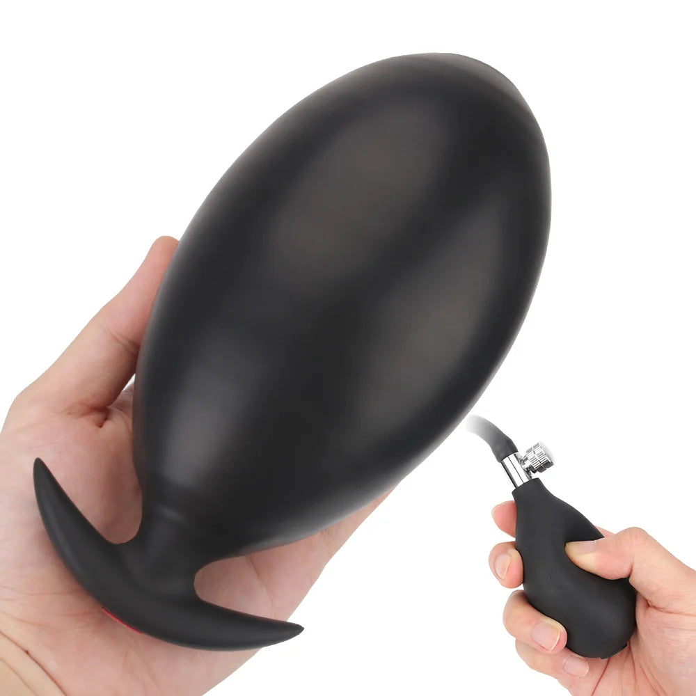 Inflatable anal plug, matte black, curved with flared base and hand-held pump nozzle