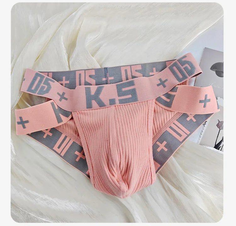 Pink ribbed stretch brief with wide elastic waistband and logo pattern.