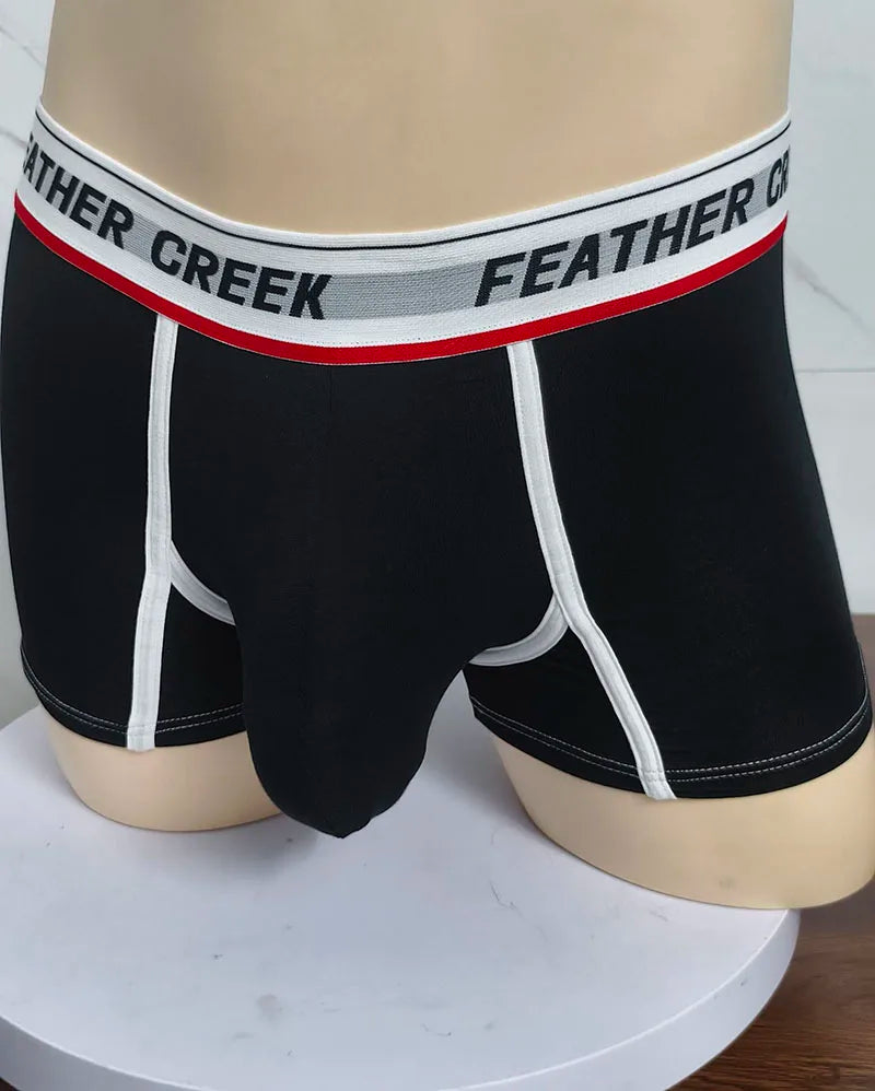 Black sports boxer shorts with white contrast seams and contoured front pouch