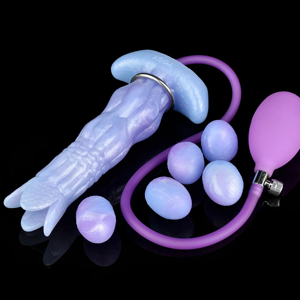 Complete set: light blue ovipositor dildo with purple tube, suction bulb, and egg pieces