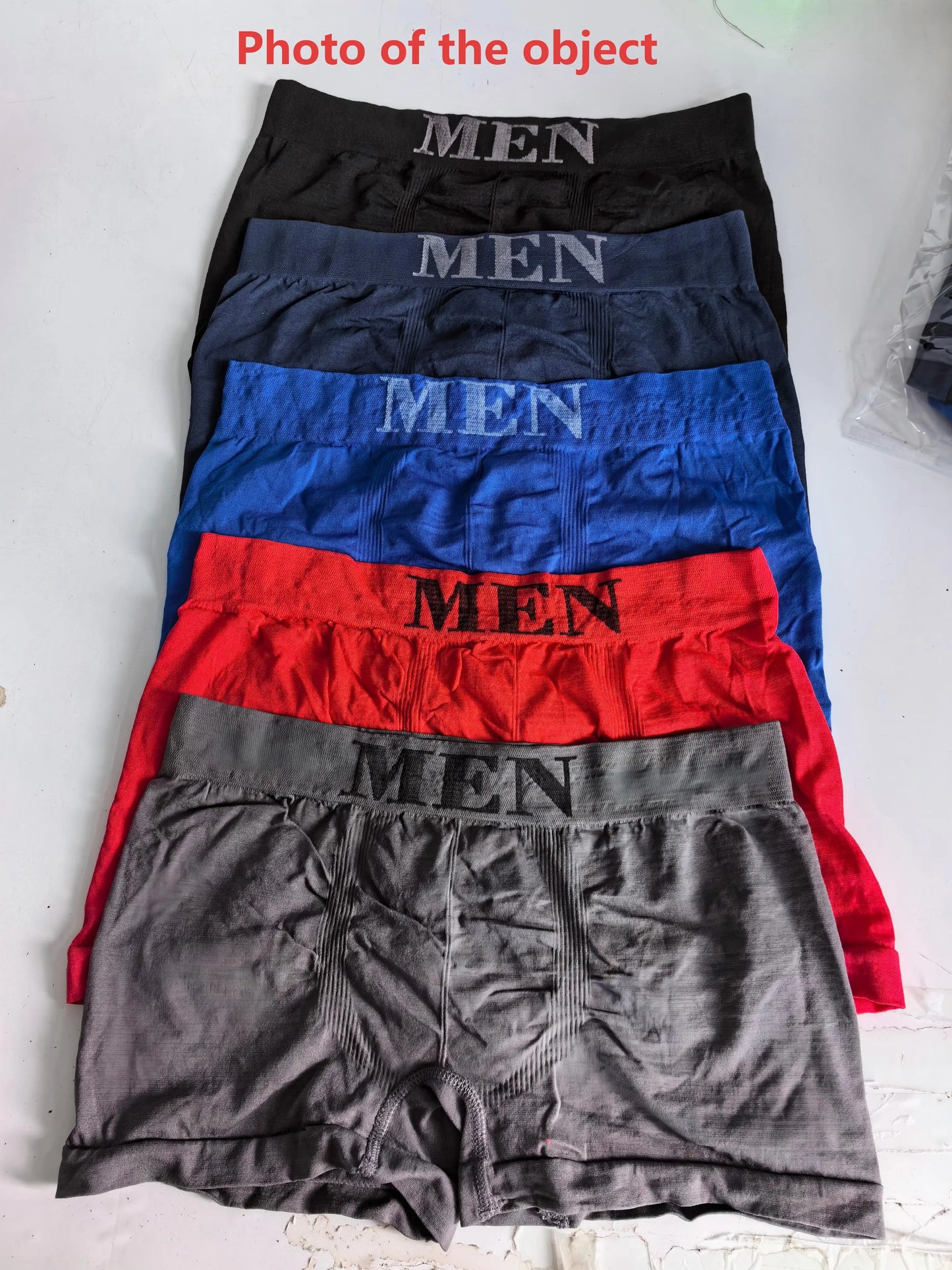 5-pack men’s boxer briefs in black, navy, blue, red, and gray with “MEN” print