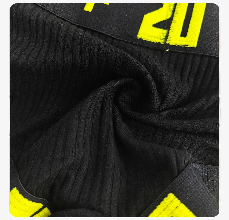 Black ribbed stretch brief close-up, elastic waistband edge visible.