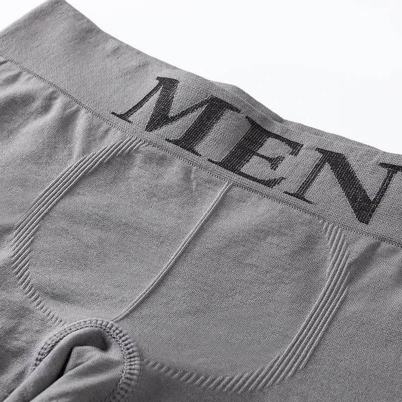 Gray stretch boxer briefs close-up of logo waistband and contoured pouch