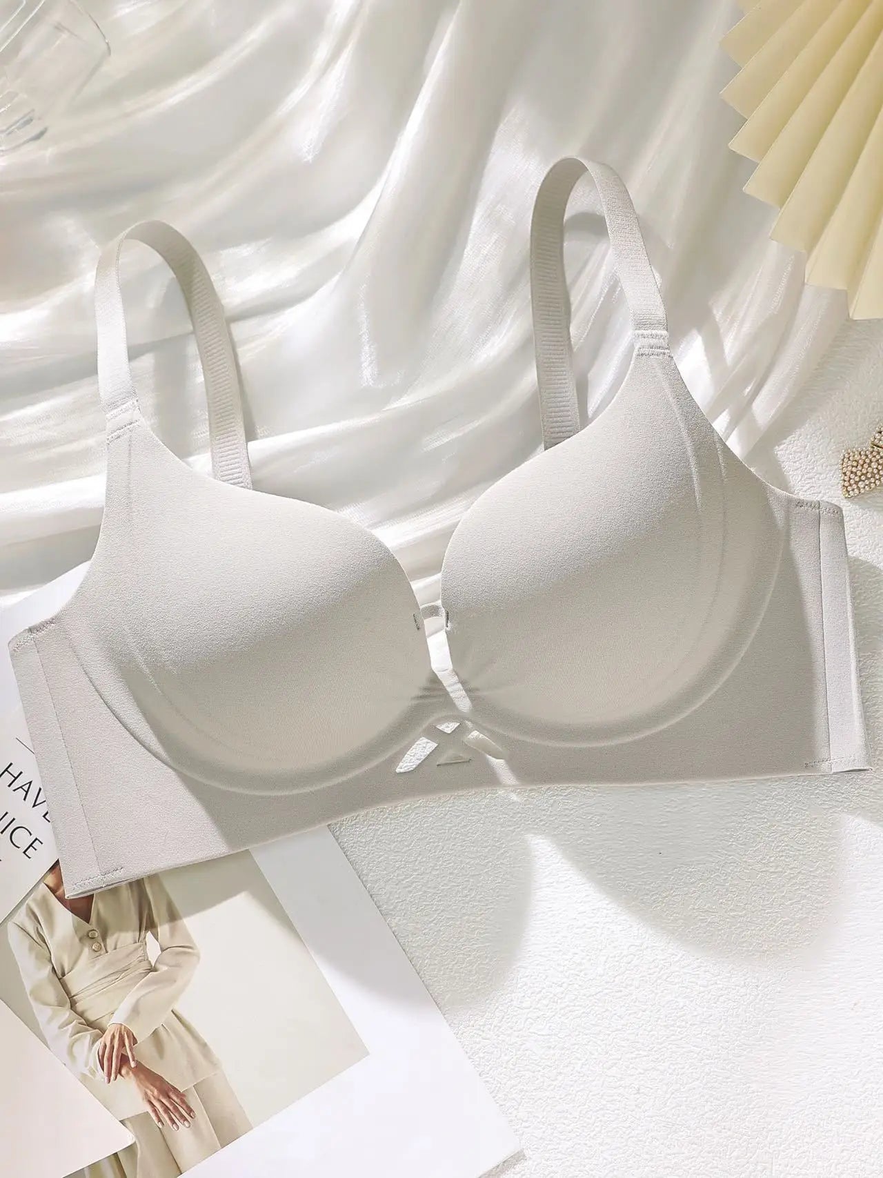 White push-up cotton bra with molded cups, elastic straps, and front cutout detail