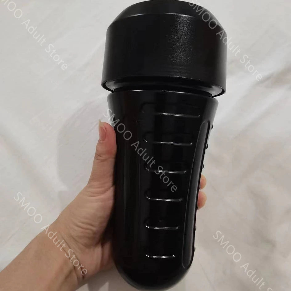 Realistic stroker cup in black, smooth outer body with ridged side grip