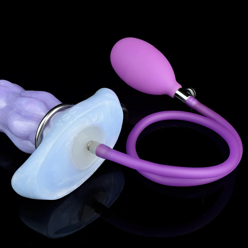 Light blue ovipositor dildo with purple suction bulb and egg accessory, angled view