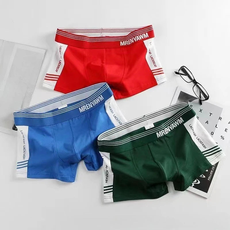 Mid-rise boxer shorts in red, blue, and dark green with striped waistbands