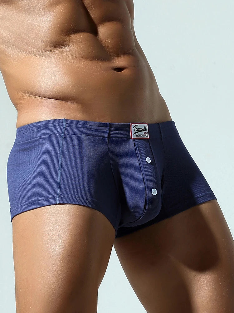 Dark blue slim-fit brief with front button placket and logo patch at waistband