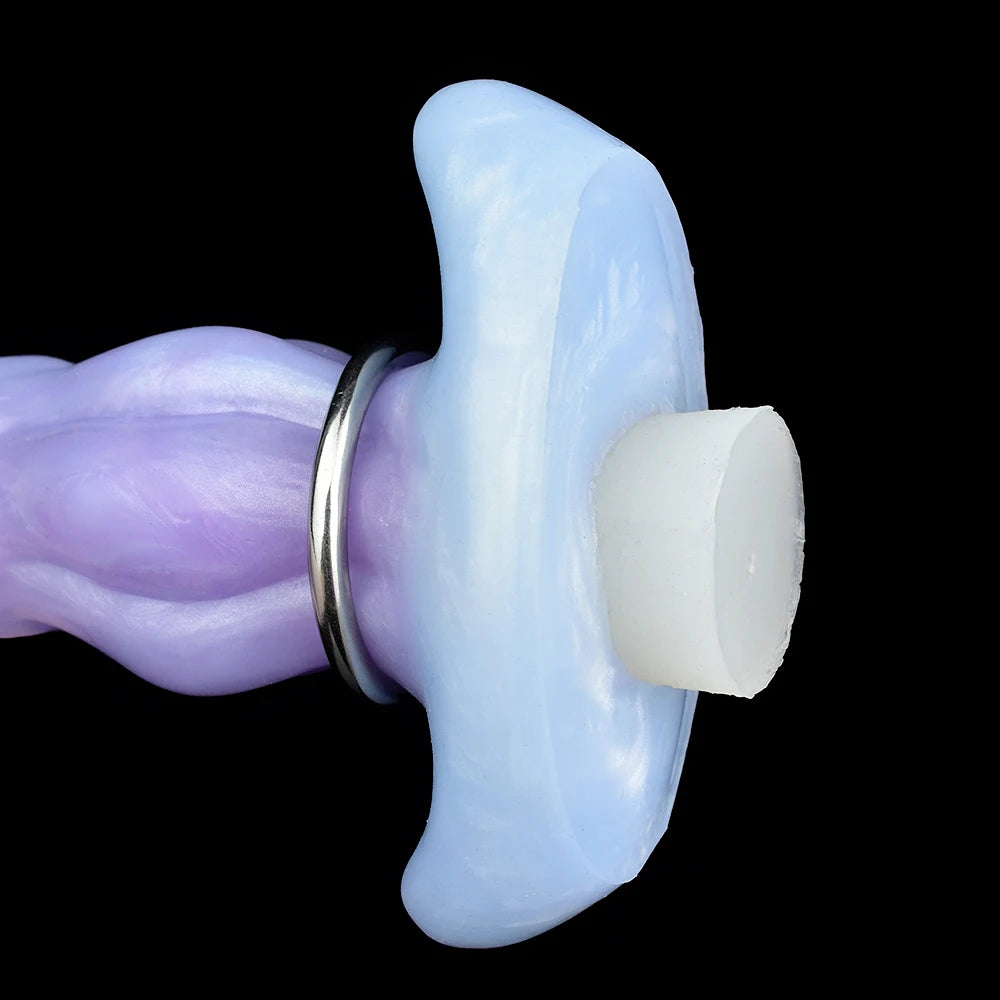 Light blue ovipositor dildo with metal ring and white egg-like cap, side close-up